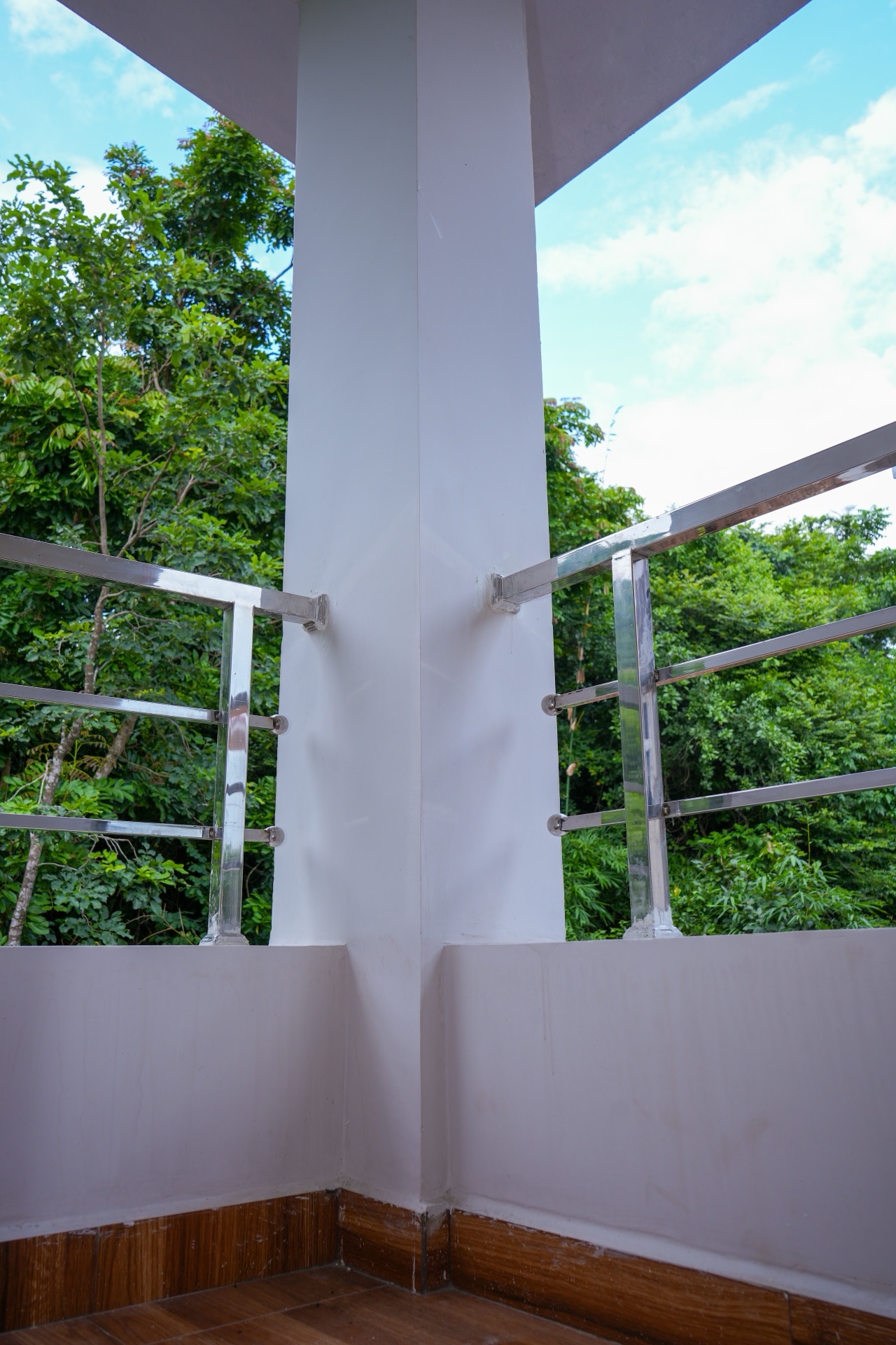 Corner verandah with a forest view