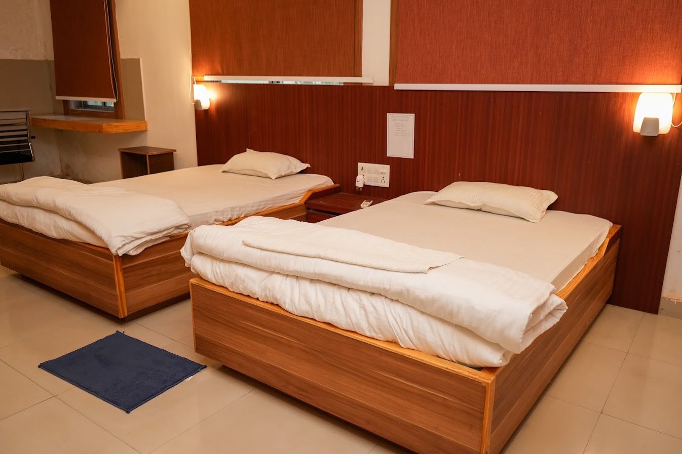 Twin-bed room with warm wood panelling